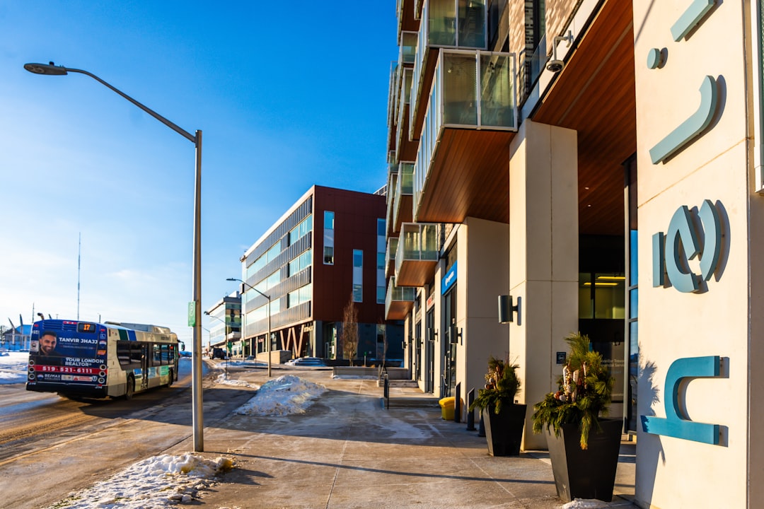 modern-building-entrance-with-bus-on-snowy-street-ytta0kkklns